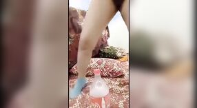 Delhi girl pushes a coca cola bottle in her cunt 1 min 00 sec