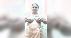Mature village aunty shows off her hairy pussy and masturbates 1 min 10 sec