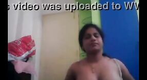 Aunty Indian's homemade sex tape featuring a mature boss and a maid 1 min 30 sec