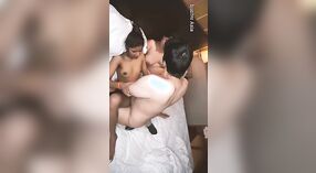 Desi couple enjoys a wild threesome with a pornographer on white sheets 3 min 00 sec