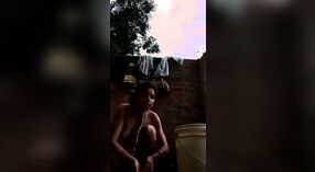 Desi babe takes a shower and shows off her sexy body in this outdoor video 1 min 40 sec