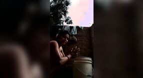 Desi babe takes a shower and shows off her sexy body in this outdoor video 2 min 00 sec