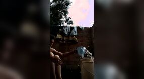 Desi babe takes a shower and shows off her sexy body in this outdoor video 1 min 00 sec