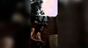 Desi babe takes a shower and shows off her sexy body in this outdoor video 1 min 10 sec