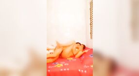 Desi wife enjoys XXX sex with her husband on a red blanket in this MMS video 1 min 40 sec