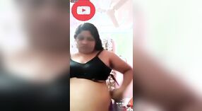 Big boobs and a costume change: a hot Tamil sex video 1 min 20 sec