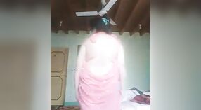 Aunty Indian's seductive striptease in a nude MMS video 1 min 50 sec