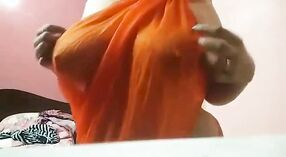 Horny Desi girl shows off her big boobs and plays with them in a yellow saree 1 min 40 sec