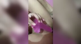 Horny girl strips down and uses a dildo to masturbate 1 min 50 sec