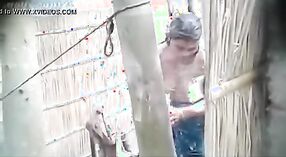 Secretly recorded outdoor shower of a village girl 1 min 40 sec