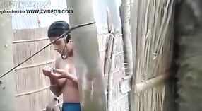 Secretly recorded outdoor shower of a village girl 2 min 00 sec