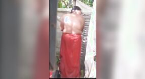 A young boy from the village secretly records his neighbors wife while she is bathing 2 min 20 sec