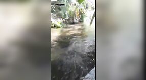 A married woman from a rural Indian community pleasures her husbands penis in a pond 5 min 00 sec