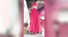 A courageous and stunning rural girl undresses and adorns a saree, showcasing her unshaven underarms and genital area. 2 min 30 sec