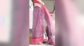 A courageous and stunning rural girl undresses and adorns a saree, showcasing her unshaven underarms and genital area. 2 min 50 sec