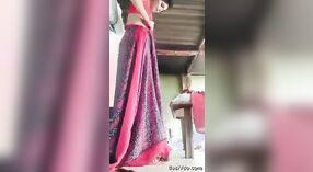 A courageous and stunning rural girl undresses and adorns a saree, showcasing her unshaven underarms and genital area. 3 min 20 sec