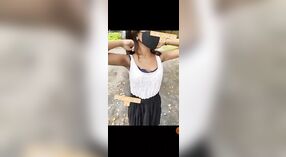 Young adult girl strips outdoors in a risqué display 1 min 20 sec