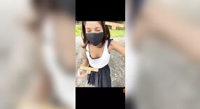 Young adult girl strips outdoors in a risqué display 1 min 40 sec