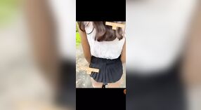 Young adult girl strips outdoors in a risqué display 0 min 40 sec