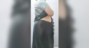 Solo Indian auntie in saree showcases her big tits and ass 3 min 00 sec